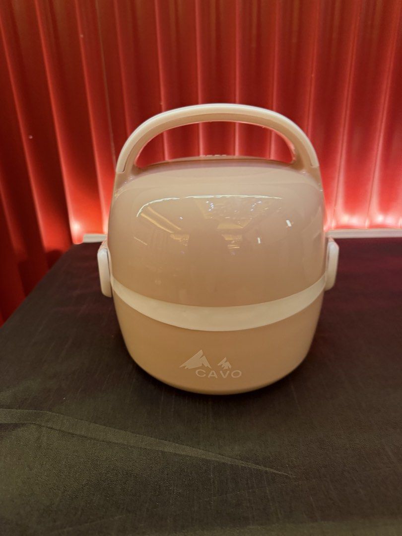 Cavo On-the-Go Heated Lunch Box (Category: Food Organization & Storage) located in Imus. Submitted by silentfire-353921 (Listing ID 1467931773, Image 1). Description: - Color: Pink - Self-heating technology with automatic safety shut-off - Dishwasher-safe removable parts for easy cleaning - Portable design with a sturdy handle and secure latch - Keeps your meals warm anytime, anywhere - Comes with the original box.