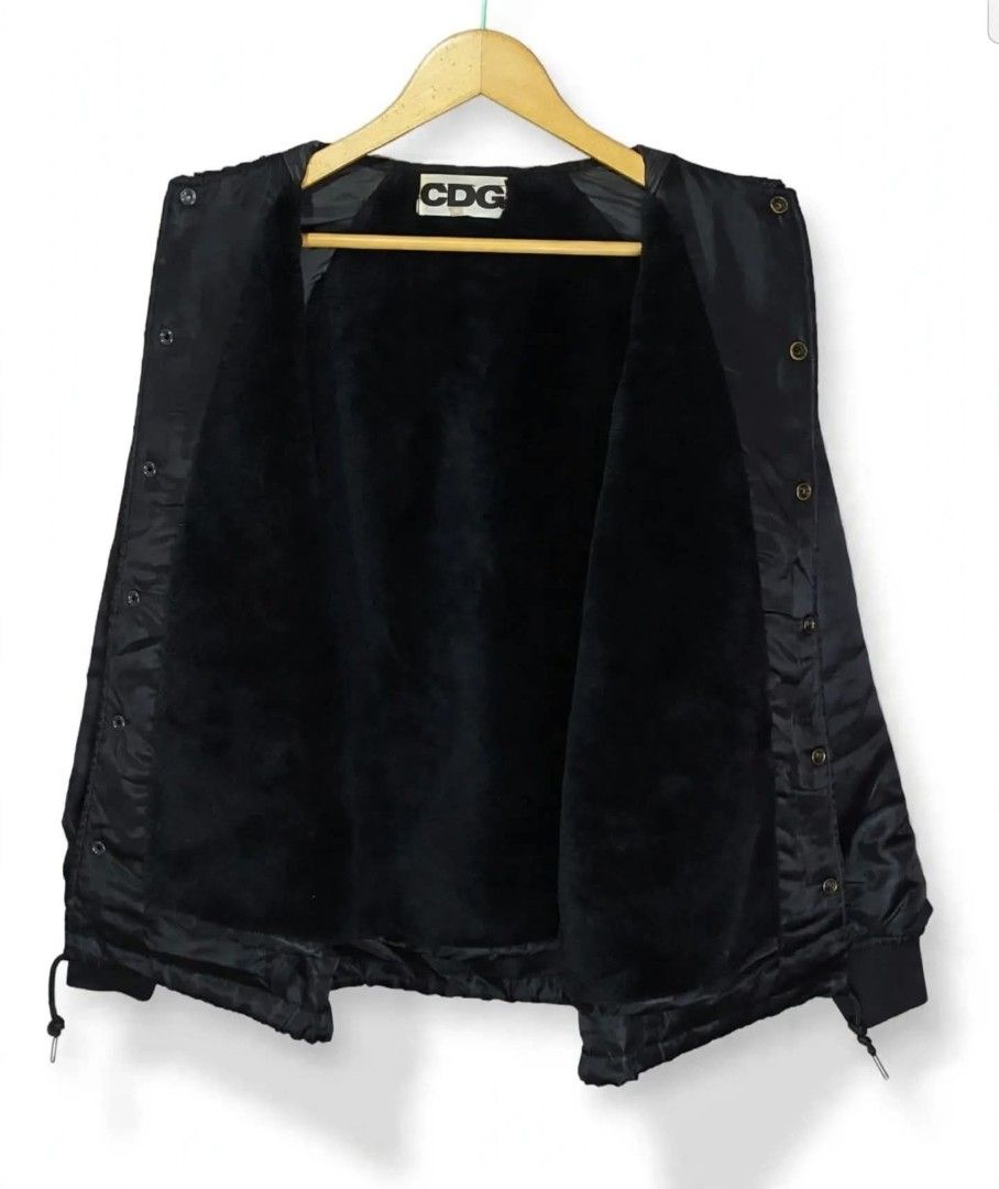 CDG | Men's Jacket Black COMME des GARÇONS CDG (Category: Coats, Jackets and Outerwear) located in Naga. Submitted by bossyingthrifts (Listing ID 1467848093, Image 3). Description: CDG | Men's Jacket Black COMME des GARÇONS CDG - Brand: Comme des Garçons (CDG) - Color: Black - Condition: Clean, excellent inside and out - Features: Snap button front, side pockets, ribbed cuffs, and adjustable drawstring hem - Lining: Fleece and Soft faux fur for e