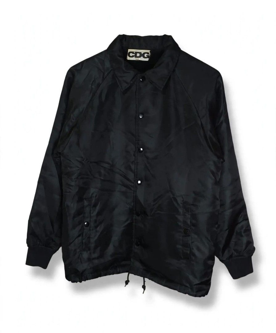 CDG | Men's Jacket Black COMME des GARÇONS CDG (Category: Coats, Jackets and Outerwear) located in Naga. Submitted by bossyingthrifts (Listing ID 1467848093, Image 1). Description: CDG | Men's Jacket Black COMME des GARÇONS CDG - Brand: Comme des Garçons (CDG) - Color: Black - Condition: Clean, excellent inside and out - Features: Snap button front, side pockets, ribbed cuffs, and adjustable drawstring hem - Lining: Fleece and Soft faux fur for e