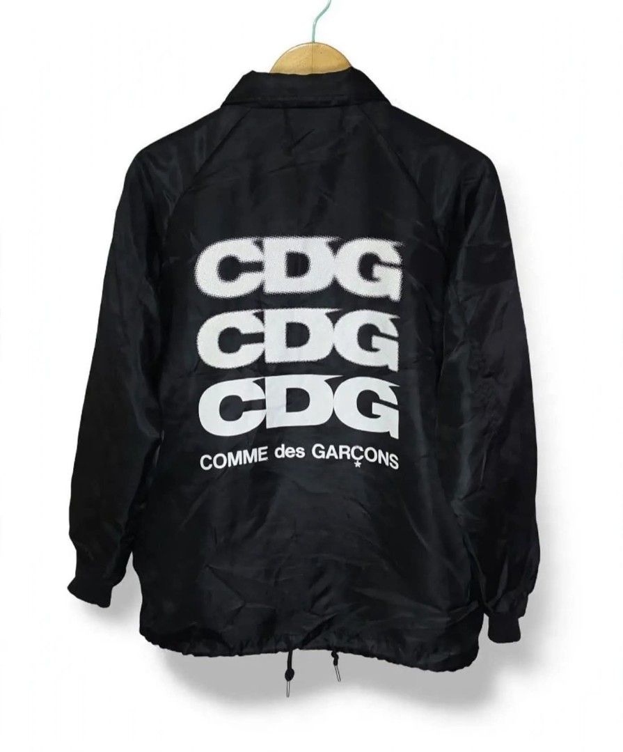 CDG | Men's Jacket Black COMME des GARÇONS CDG (Category: Coats, Jackets and Outerwear) located in Naga. Submitted by bossyingthrifts (Listing ID 1467848093, Image 2). Description: CDG | Men's Jacket Black COMME des GARÇONS CDG - Brand: Comme des Garçons (CDG) - Color: Black - Condition: Clean, excellent inside and out - Features: Snap button front, side pockets, ribbed cuffs, and adjustable drawstring hem - Lining: Fleece and Soft faux fur for e