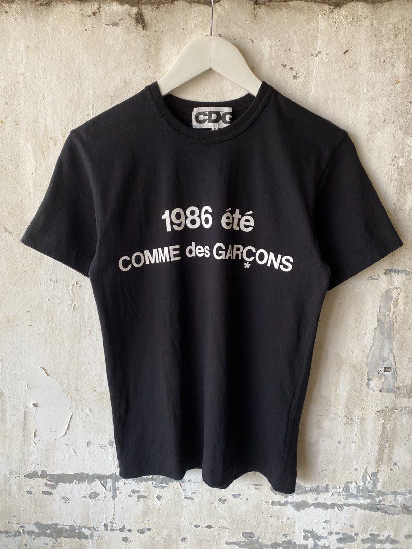 CDG Comme des Garcons - 1986 été Tee (Category: Tshirts & Polo Shirts ) located in Puerto Princesa. Submitted by something___. (Listing ID 1467890838, Image 2). Description: CDG Comme des Garcons - 1986 été Tee Tagged Size: Small Length: 25.5 Width: 18.2 Condition: Excellent Color rate: 9.8 Flaws: None.