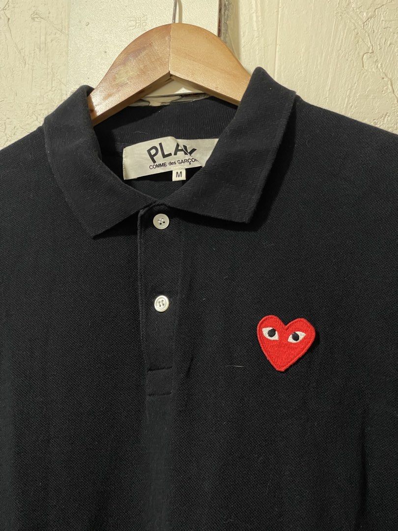 CDG Play polo shirt in Black Authentic (Category: Luxury Apparel) located in Marikina City. Submitted by joshuaades21107 (Listing ID 1468014935, Image 2). Description: Authentic CDG play black polo shirt Medium on tag 19 width 25 length In excellent condition 9.5 color rate .