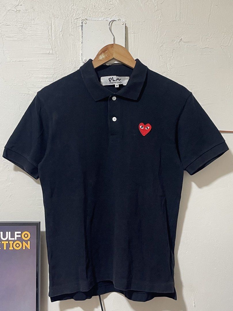 CDG Play polo shirt in Black Authentic (Category: Luxury Apparel) located in Marikina City. Submitted by joshuaades21107 (Listing ID 1468014935, Image 1). Description: Authentic CDG play black polo shirt Medium on tag 19 width 25 length In excellent condition 9.5 color rate .