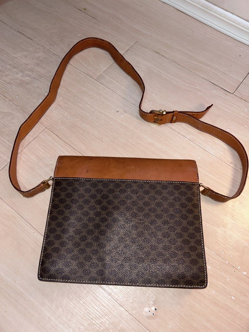 Celine Macadam Brown Monogram Leather Shoulder Bag (Category: Luxury Bags & Wallets) located in Dipolog. Submitted by adrian281994 (Listing ID 1467972089, Image 2). Description: - Brand: Celine - Style: Crossbody bag - Material: Brown Macadam monogram coated canvas with tan leather trim - Hardware: Gold-tone hardware with front Celine clasp closure - Strap: Adjustable shoulder strap - Interior: Divided compartments lined in tan leather, plus an i