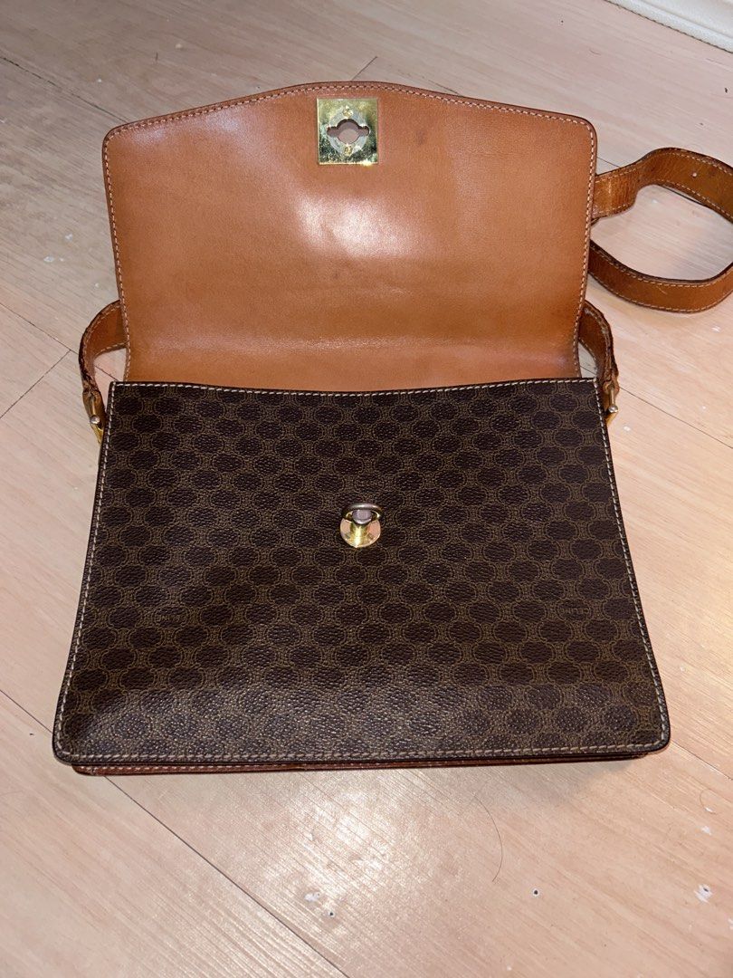 Celine Macadam Brown Monogram Leather Shoulder Bag (Category: Luxury Bags & Wallets) located in Dipolog. Submitted by adrian281994 (Listing ID 1467972089, Image 3). Description: - Brand: Celine - Style: Crossbody bag - Material: Brown Macadam monogram coated canvas with tan leather trim - Hardware: Gold-tone hardware with front Celine clasp closure - Strap: Adjustable shoulder strap - Interior: Divided compartments lined in tan leather, plus an i