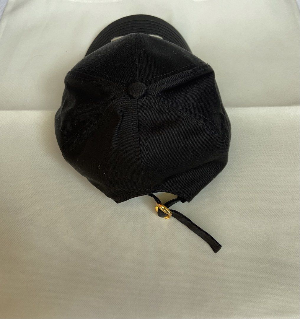 Celine Triomphe Baseball Cap (Category: Caps & Hats) located in Makati City. Submitted by ellope (Listing ID 1467915666, Image 3). Description: Celine baseball cap in black cotton with cream Triomphe embroidery on the front. Size M. Gold-tone adjustable metal buckle stamped with Celine Paris. With Celine paper shopping bag. Used but washed already .