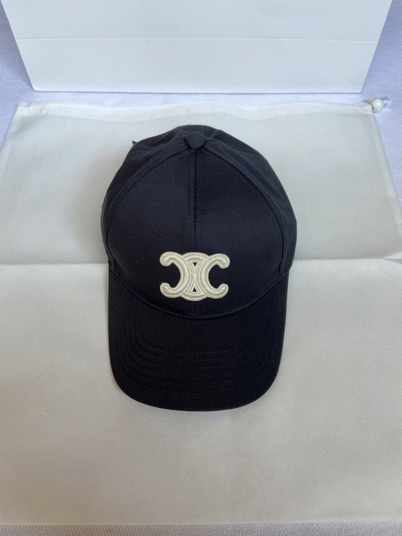 Celine Triomphe Baseball Cap (Category: Caps & Hats) located in Makati City. Submitted by ellope (Listing ID 1467915666, Image 2). Description: Celine baseball cap in black cotton with cream Triomphe embroidery on the front. Size M. Gold-tone adjustable metal buckle stamped with Celine Paris. With Celine paper shopping bag. Used but washed already .