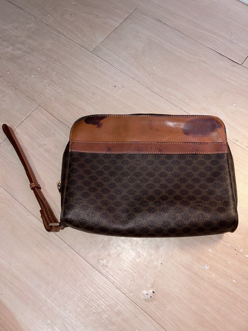 Celine Vintage Macadam Clutch bag (Category: Luxury Bags & Wallets) located in Dipolog. Submitted by adrian281994 (Listing ID 1467972334, Image 3). Description: - Brand: Celine - Material: Macadam and leather - Hardware: Gold-tone - Closure: Zipper - Inclusions: Removable leather wrist strap - Interior: Dark fabric lining with a slip pocket and stamped leather tag - Flaws: Discoloration and dark staining on the top leather flap section - Trusted 