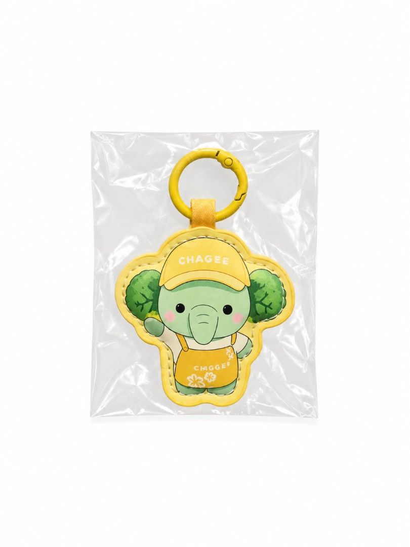 CHAGEE Baby Elephant Plush Keychain / Key Ring (Category: Other Merchandise) located in Pasig City. Submitted by swipeandpicks (Listing ID 1467995211, Image 1). Description: • Color: Pastel Mint Green (Elephant), Bright Lemon Yellow (Cap, Apron, Leather Frame, and Carabiner Clasp) • Material: Premium PU Leather (Outer protective frame and strap) + Soft Velveteen/Plush Fabric (Inner elephant doll) + Sturdy Zinc Alloy (Metal carabiner hook) •Size: 