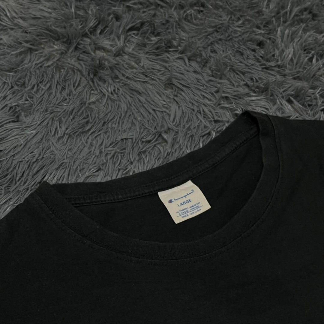 Champion Black Script Logo T-Shirt Size L (Category: Tshirts & Polo Shirts ) located in Batangas. Submitted by jaylord_g (Listing ID 1468050113, Image 3). Description: - Brand: Champion - Color: Black - Size: Large - Design: Large embroidered script logo across the chest - Details: Woven brand label near the bottom hem and small embroidered logo patch on the left sleeve - Fit: Crew neck, short sleeves - Condition: Clean fabric with standard inner
