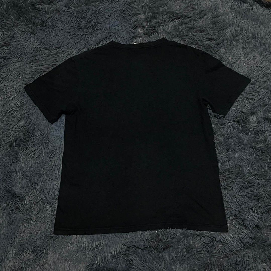 Champion Black Script Logo T-Shirt Size L (Category: Tshirts & Polo Shirts ) located in Batangas. Submitted by jaylord_g (Listing ID 1468050113, Image 2). Description: - Brand: Champion - Color: Black - Size: Large - Design: Large embroidered script logo across the chest - Details: Woven brand label near the bottom hem and small embroidered logo patch on the left sleeve - Fit: Crew neck, short sleeves - Condition: Clean fabric with standard inner