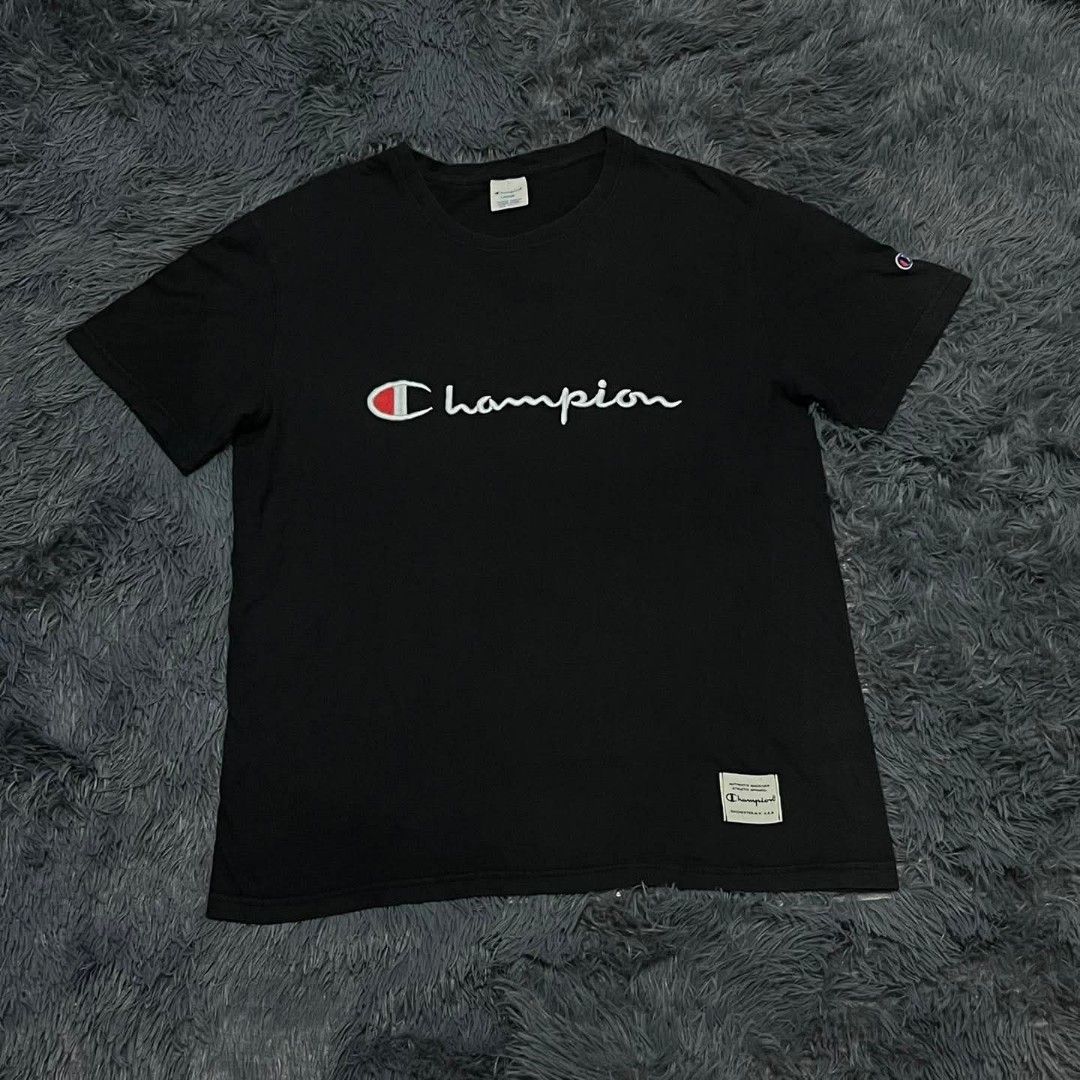 Champion Black Script Logo T-Shirt Size L (Category: Tshirts & Polo Shirts ) located in Batangas. Submitted by jaylord_g (Listing ID 1468050113, Image 1). Description: - Brand: Champion - Color: Black - Size: Large - Design: Large embroidered script logo across the chest - Details: Woven brand label near the bottom hem and small embroidered logo patch on the left sleeve - Fit: Crew neck, short sleeves - Condition: Clean fabric with standard inner