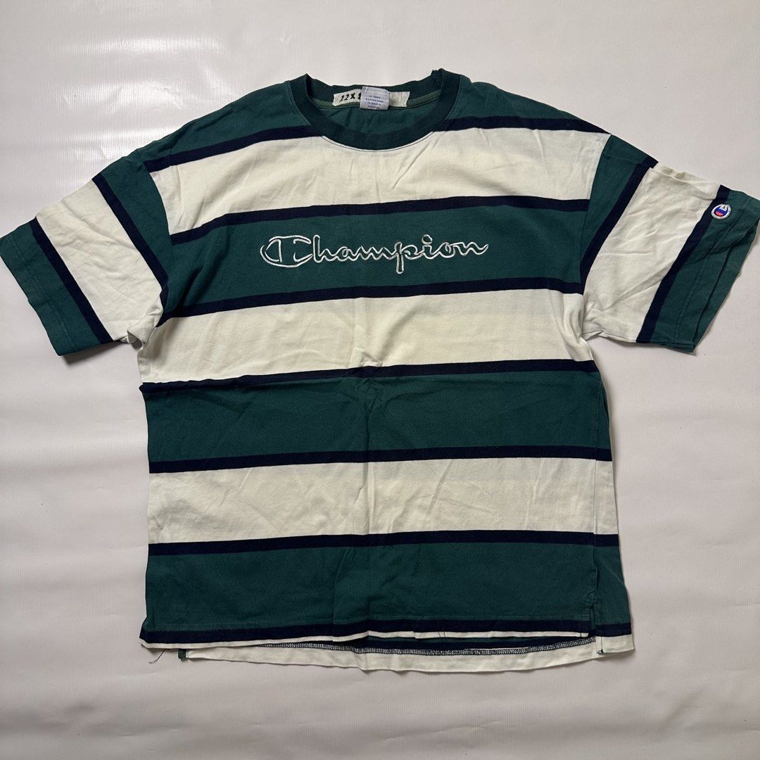 Champion Green Striped Tee (Category: Tshirts & Polo Shirts ) located in Gapan. Submitted by rasthriftshop17 (Listing ID 1467996977, Image 1). Description: Size on tag: L Dimes: 22 x 28 Condition: Excellent Color rate: 9/10 Issue: None.