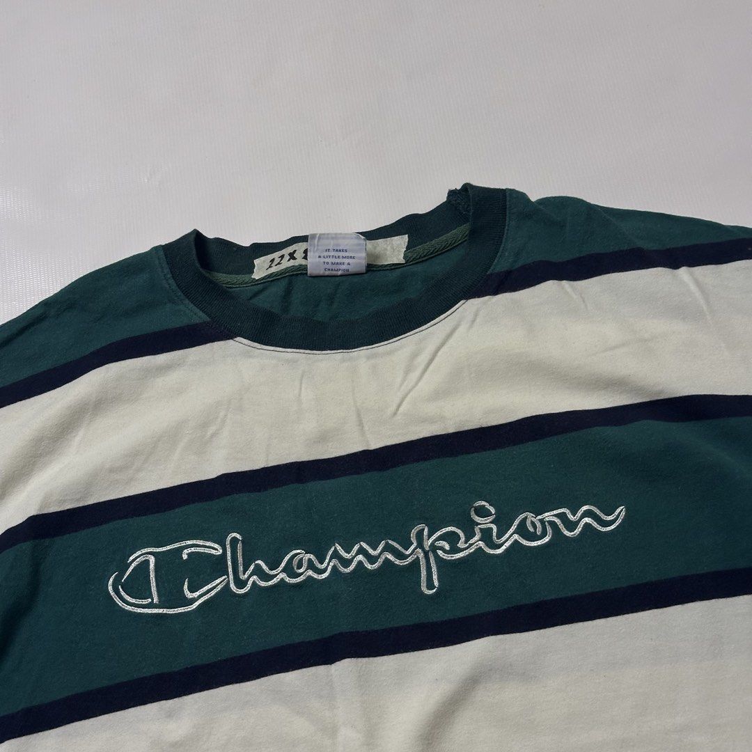 Champion Green Striped Tee (Category: Tshirts & Polo Shirts ) located in Gapan. Submitted by rasthriftshop17 (Listing ID 1467996977, Image 2). Description: Size on tag: L Dimes: 22 x 28 Condition: Excellent Color rate: 9/10 Issue: None.