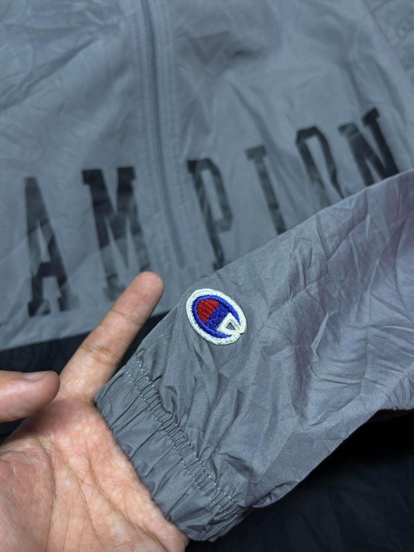 Champion Script Kangaroo Pocket Lightweight Windbreaker (Category: Hoodies) located in Tayabas. Submitted by retro.rags69 (Listing ID 1467847031, Image 3). Description: • Excellent condition • Color rate: 9.5/10 • width: 26.5 • length: 30 • No Issue • Printed Logo Design • Two-tone Colorway • Packable can turn into small pouch • Best Fit: XL-2XL.
