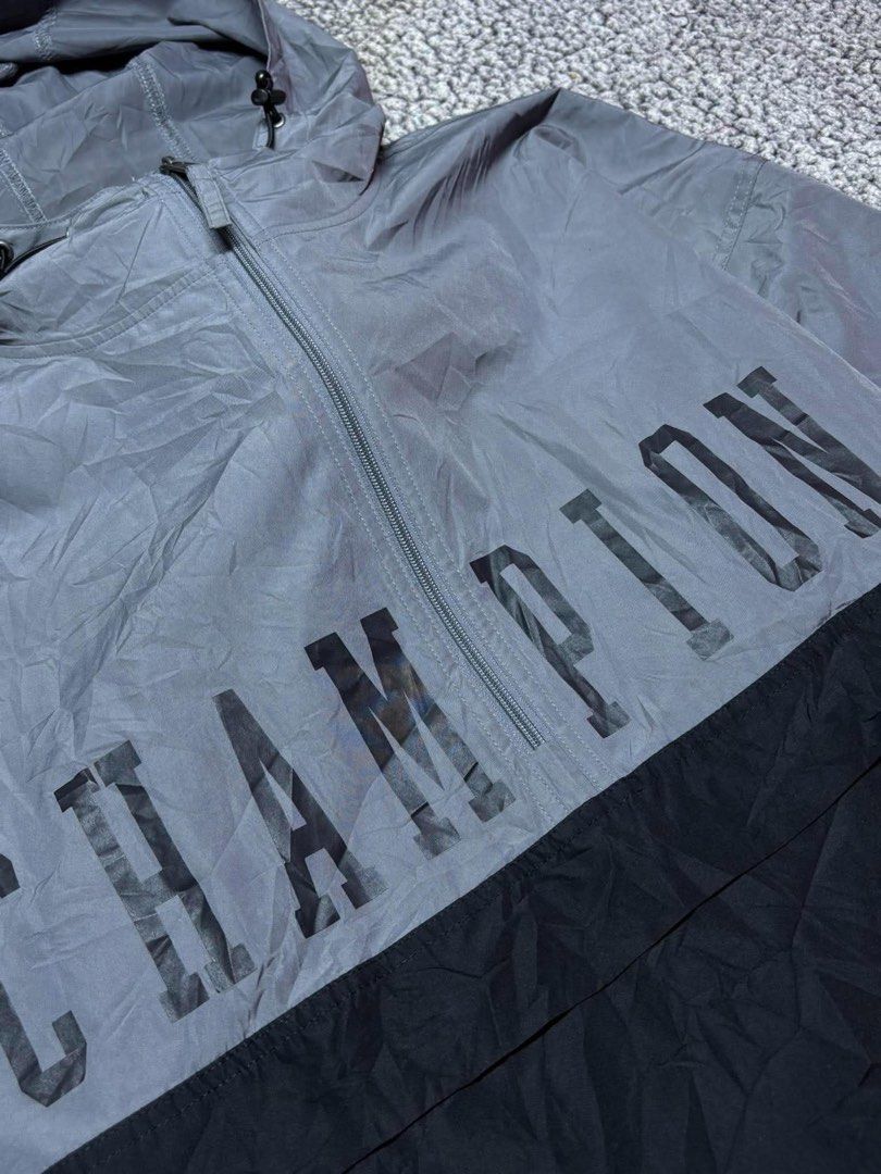 Champion Script Kangaroo Pocket Lightweight Windbreaker (Category: Hoodies) located in Tayabas. Submitted by retro.rags69 (Listing ID 1467847031, Image 2). Description: • Excellent condition • Color rate: 9.5/10 • width: 26.5 • length: 30 • No Issue • Printed Logo Design • Two-tone Colorway • Packable can turn into small pouch • Best Fit: XL-2XL.