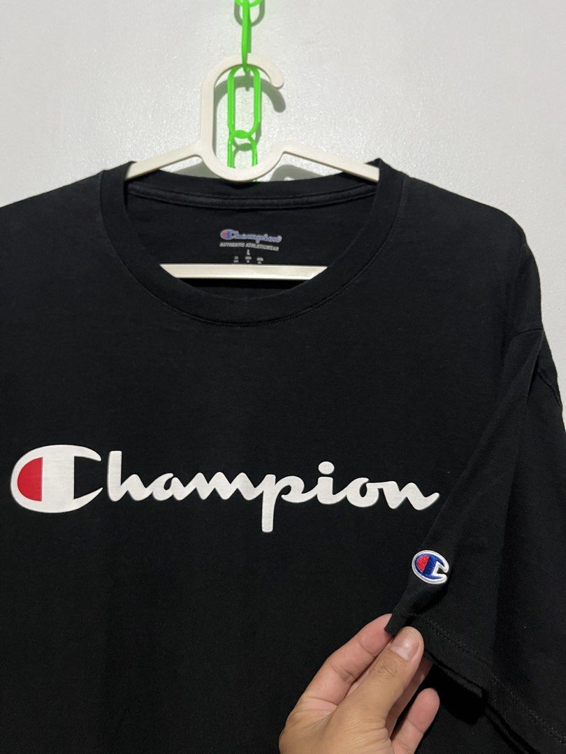 Champion script logo tee (Category: Activewear) located in Cebu City. Submitted by thrift.sht (Listing ID 1467944764, Image 2). Description: CHAMPION Script Logo Tee - Black 🖤 ✔ Brand: Champion - 100% Legit (Authentic Athleticwear) ✔ Size: L on tag - Fits L to XL (Oversized fit) ✔ Color: Black - Deep black pa, not faded ✔ Condition: 9/10 - Good condition, no butas, no lints ✔ Material: Cotton - makapal ✔ Details: - Big Champion Script Logo sa ch