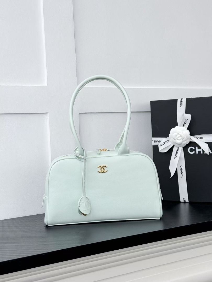 Chanel Mint Green Leather Shoulder Bag (Category: Luxury Bags & Wallets) located in Mandaluyong City. Submitted by slyvkaespe03655 (Listing ID 1467897553, Image 1). Description: - Authentic Chanel shoulder bag in a gorgeous mint green leather - Elegant gold hardware with a top zip closure and comfortable double handles - Features a signature round charm with the embossed interlocking CC logo - Pristine, clean interior with smooth, well-maintained