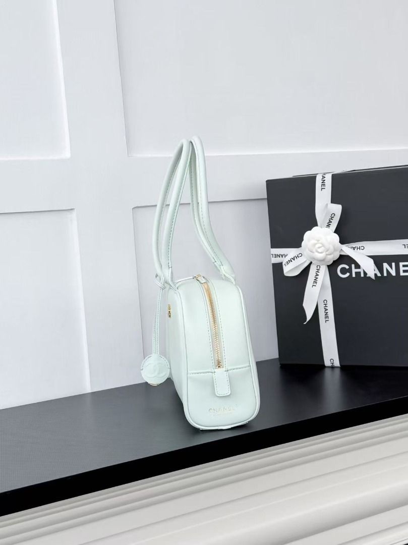 Chanel Mint Green Leather Shoulder Bag (Category: Luxury Bags & Wallets) located in Mandaluyong City. Submitted by slyvkaespe03655 (Listing ID 1467897553, Image 3). Description: - Authentic Chanel shoulder bag in a gorgeous mint green leather - Elegant gold hardware with a top zip closure and comfortable double handles - Features a signature round charm with the embossed interlocking CC logo - Pristine, clean interior with smooth, well-maintained