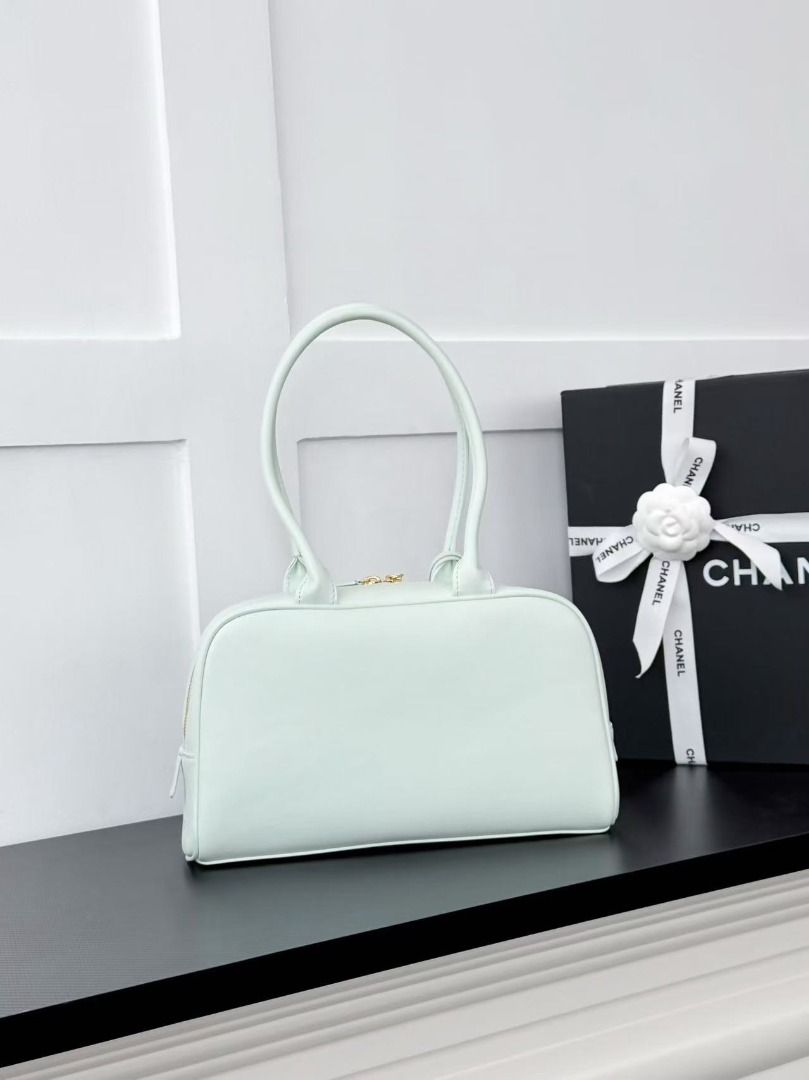 Chanel Mint Green Leather Shoulder Bag (Category: Luxury Bags & Wallets) located in Mandaluyong City. Submitted by slyvkaespe03655 (Listing ID 1467897553, Image 2). Description: - Authentic Chanel shoulder bag in a gorgeous mint green leather - Elegant gold hardware with a top zip closure and comfortable double handles - Features a signature round charm with the embossed interlocking CC logo - Pristine, clean interior with smooth, well-maintained