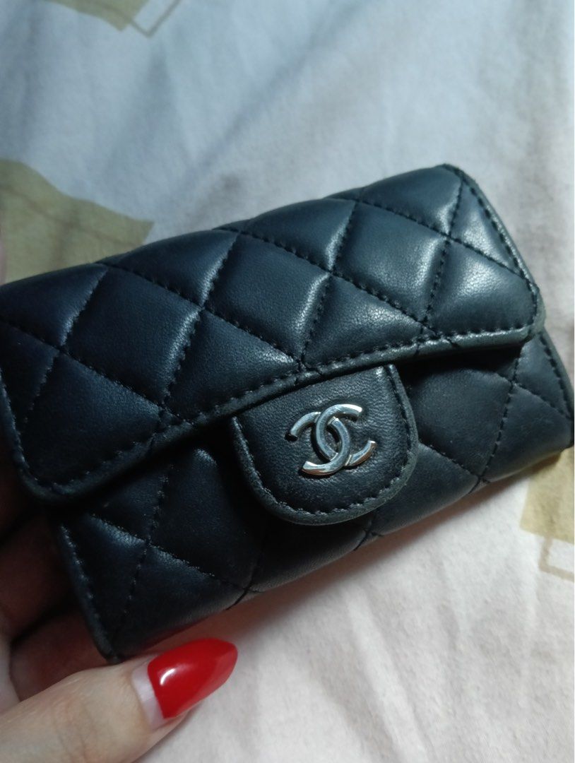 Chanel Quilted Black Leather Key Holder Case (Category: Wallets & Card holders) located in Manila. Submitted by goddesssy (Listing ID 1467840150, Image 1). Description: - Brand: Chanel - Material: Black quilted lambskin leather - Hardware: Silver-tone CC hardware - Interior: Burgundy lining with pocket - Authenticity: Serial sticker reads 29393841, Made in Italy stamp - Closure: Front flap snap closure - Condition: Compact size, normal signs of h