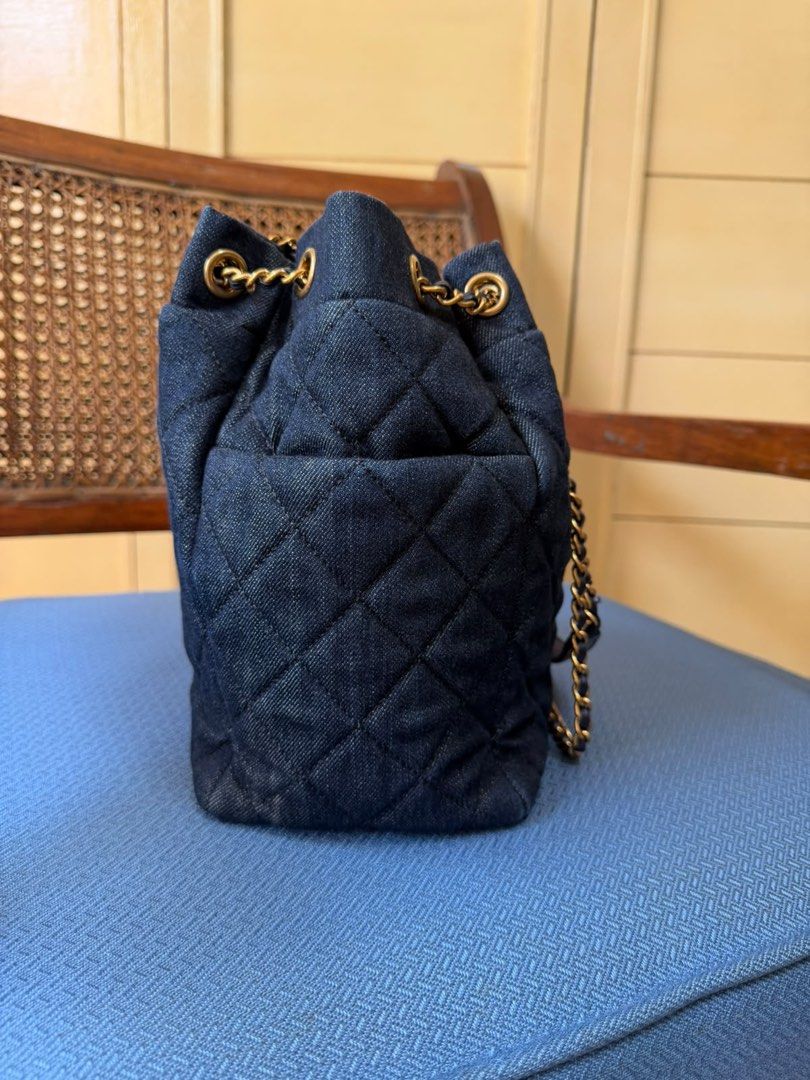 Chanel Quilted Denim Bucket Bag (Category: Luxury Bags & Wallets) located in Mandaluyong City. Submitted by marceditems (Listing ID 1467845107, Image 3). Description: -Chanel Denim Bucket Bag - Series 22, hologram intact - Hardware: Gold-tone chain interwoven with leather and classic CC charm - Closure: Drawstring top - no flaws and comes with box.