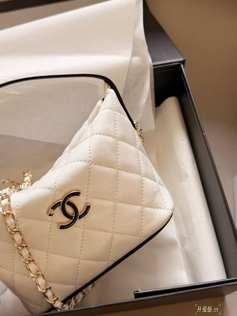 Chanel Quilted White Leather Chain Shoulder Bag (Category: Luxury Bags & Wallets) located in Navotas City. Submitted by kaimaieinm89351 (Listing ID 1467924362, Image 2). Description: - Authentic Chanel quilted leather handbag in classic white - Luxurious mixed gold-tone hardware and leather interwoven chain strap - Chic top handle design with secure zipper closure and black pull tab - Clean fabric interior featuring the iconic gold 'Made in Italy
