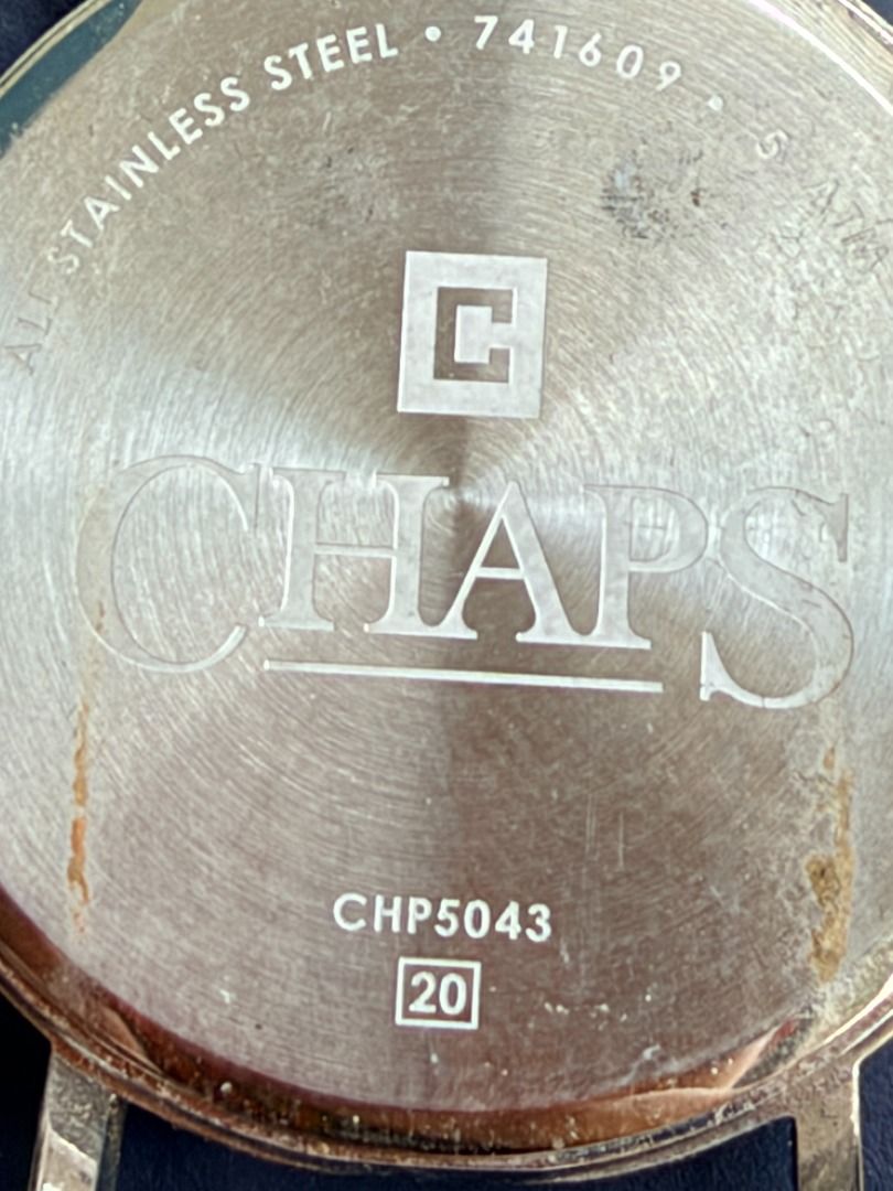 Chaps CHP5043 Leather Strap Watch (Category: Women's Watches) located in Quezon City. Submitted by 30somethingtreasures (Listing ID 1467988624, Image 3). Description: - Brand: Chaps - Dial: Dark textured finish - Strap: Genuine brown leather - Case Back: Stainless steel (CHP5043, 741609) - Packaging: Includes original blue Chaps logo box - Style: Classic everyday timepiece - Condition: Well-maintained.