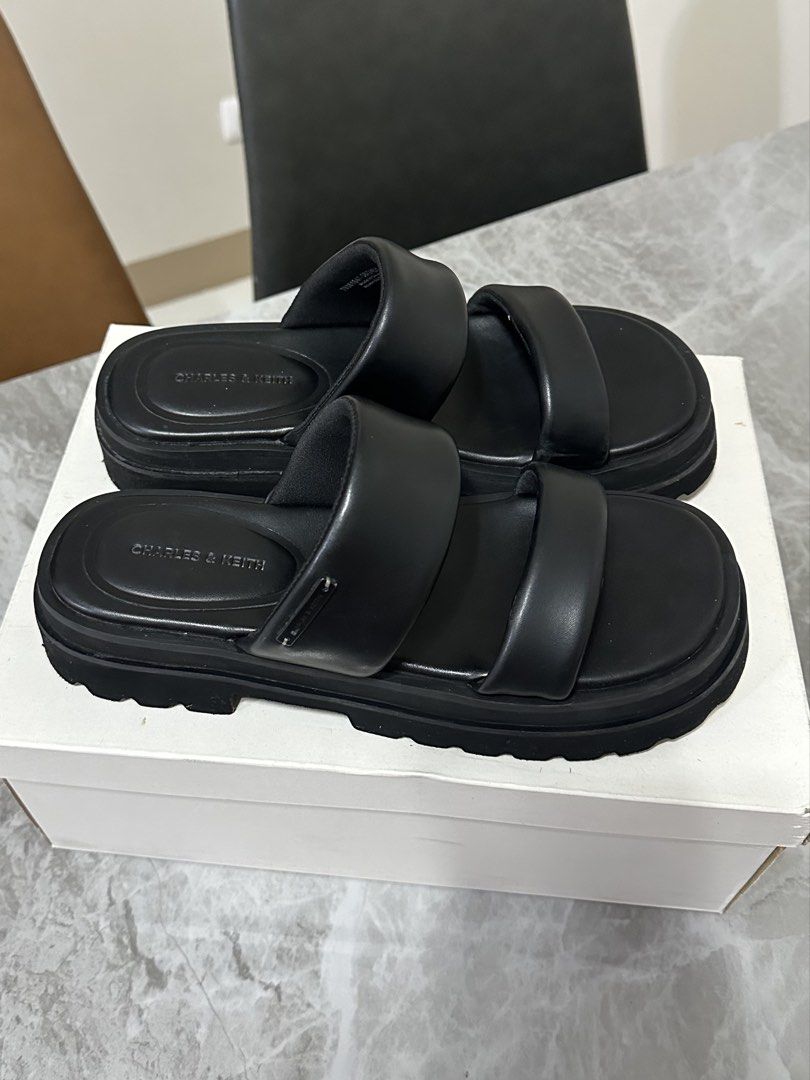 Charles & Keith Double Strap Platform Sandals Black (Category: Flats & Sandals) located in Paranaque City. Submitted by safepenguin_c6a36a (Listing ID 1468000198, Image 3). Description: - Brand: Charles & Keith - Tattie Puffy-Strap Sandals - Color: Black - Style: Double strap chunky platform sandals with a trendy silhouette - Comfort: Super comfortable puffy straps for all-day wear - Versatility: Great everyday footwear that matches almost any ca