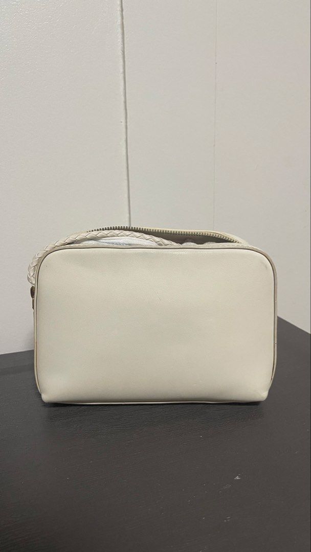 Charles & Keith White Crossbody Bag with Braided Strap (Category: Cross-body Bags) located in Magalang. Submitted by josephinenl (Listing ID 1467897794, Image 2). Description: Authentic. Good condition. Brand: Charles & Keith - Style: Camera bag / purse - Color: Versatile off-white neutral - Details: Gold foil brand lettering on front - Closure: Secure double zipper across the top - Strap: Long, stylish braided strap - Shape: Clean and structured