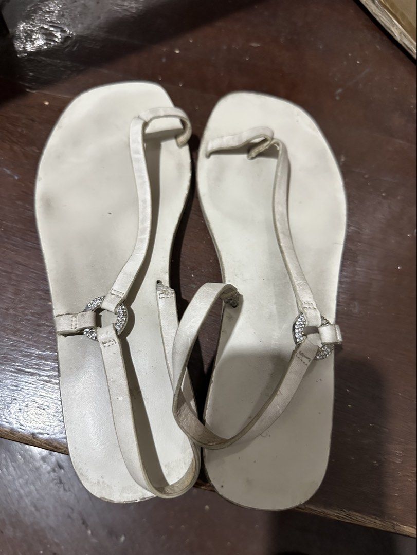 Charles & Keith White Sandals (Category: Flats & Sandals) located in Manila. Submitted by shopkriscloset (Listing ID 1467841657, Image 1). Description: Needs cleaning/whitening :) Issues: minimal cracks/peelings on the leather. Can send more photos upon request ‼️PLEASE READ BEFORE PLACING AN OFFER -Please be patient and respectful. 🤗 If I don’t get to reply immediately, I might be working. - Please REFRAIN from making an offer if you do not int