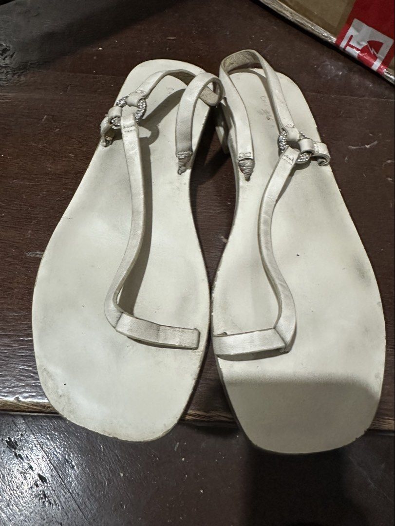 Charles & Keith White Sandals (Category: Flats & Sandals) located in Manila. Submitted by shopkriscloset (Listing ID 1467841657, Image 3). Description: Needs cleaning/whitening :) Issues: minimal cracks/peelings on the leather. Can send more photos upon request ‼️PLEASE READ BEFORE PLACING AN OFFER -Please be patient and respectful. 🤗 If I don’t get to reply immediately, I might be working. - Please REFRAIN from making an offer if you do not int