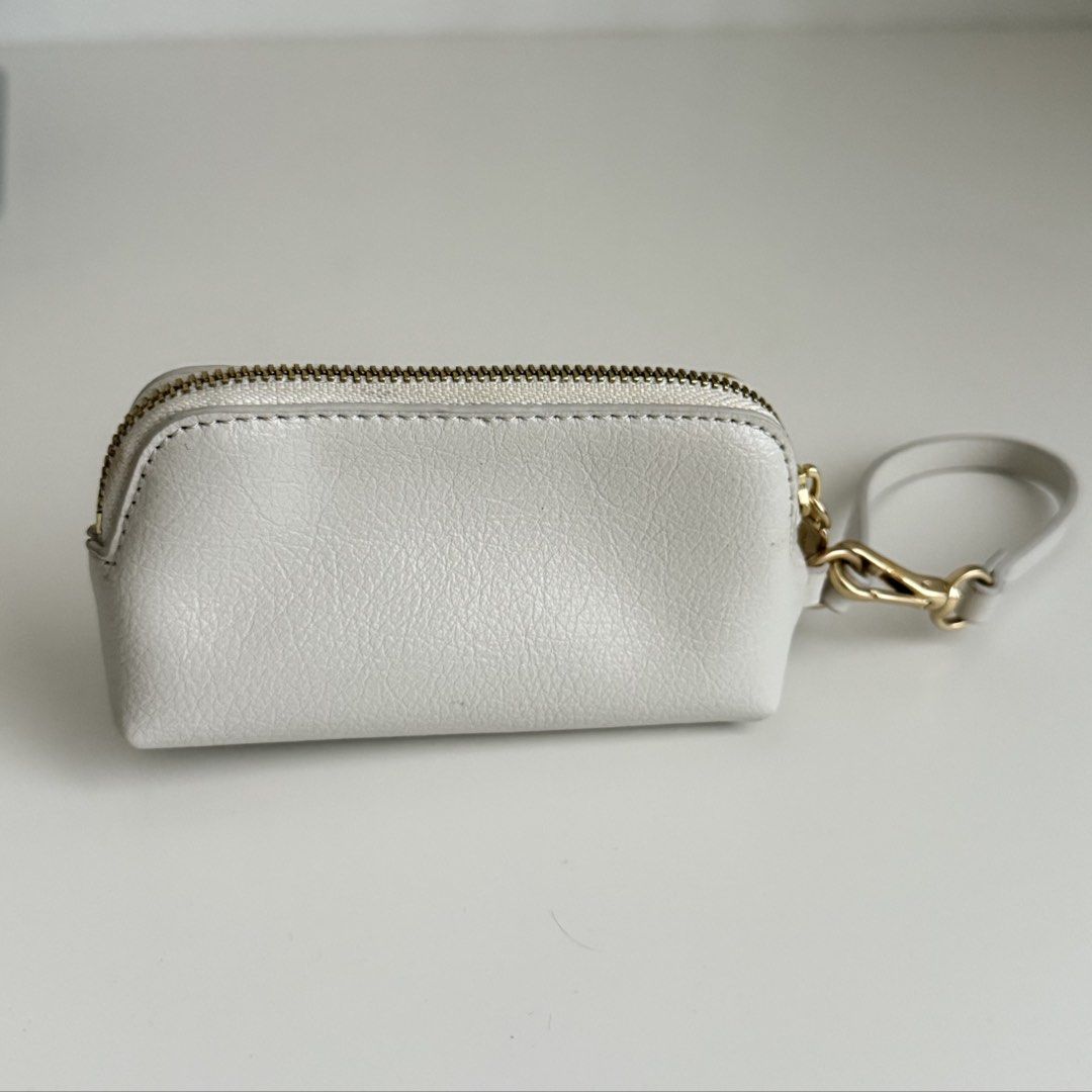 Charles & Keith Wristlet/Coin Purse (Category: Cross-body Bags) located in Quezon City. Submitted by 0ffTheRack (Listing ID 1467888619, Image 2). Description: - Gold hardware - Detachable wrist strap and clasp - Excellent condition - No scratches on hardware - Clean interior and exterior.