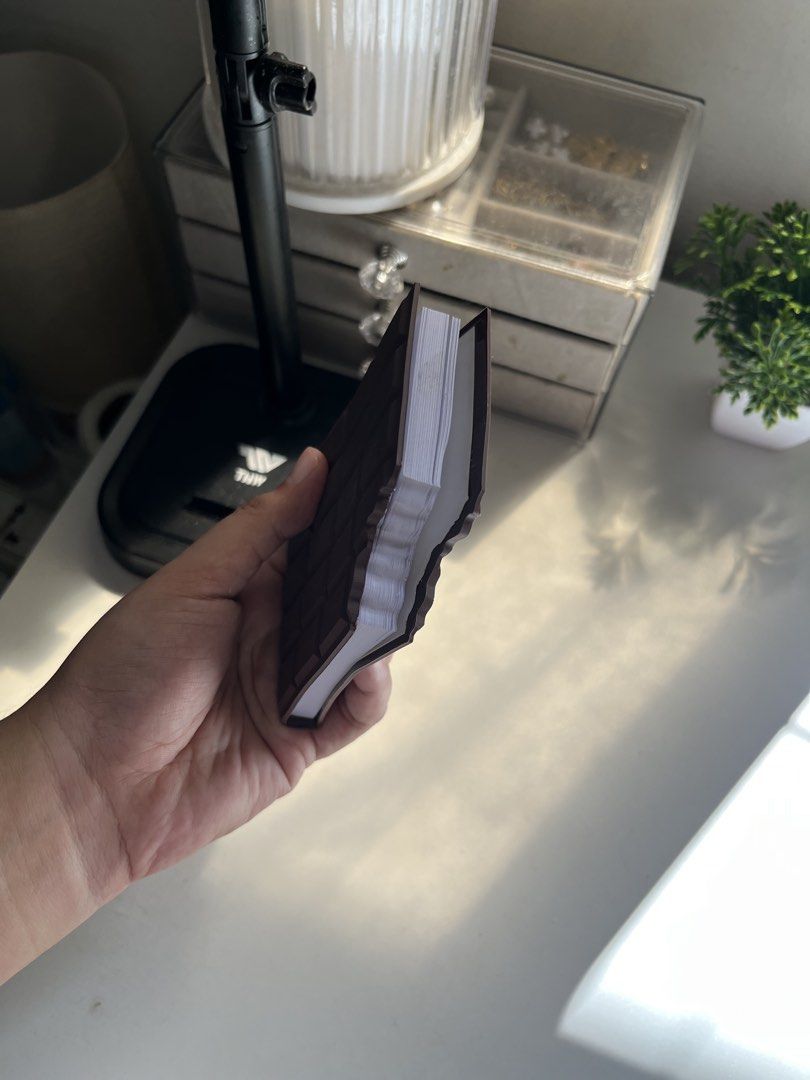 Chocolate Bar Novelty Notebook with Box (Category: Stationery & School Supplies) located in Taguig. Submitted by qwer123ave (Listing ID 1467891919, Image 3). Description: - Unique chocolate bar design with a fun "bite" shape - Features blank white pages inside, great for notes or journaling - Comes with its original cardboard box packaging - Perfect gift idea for students and stationery lovers.
