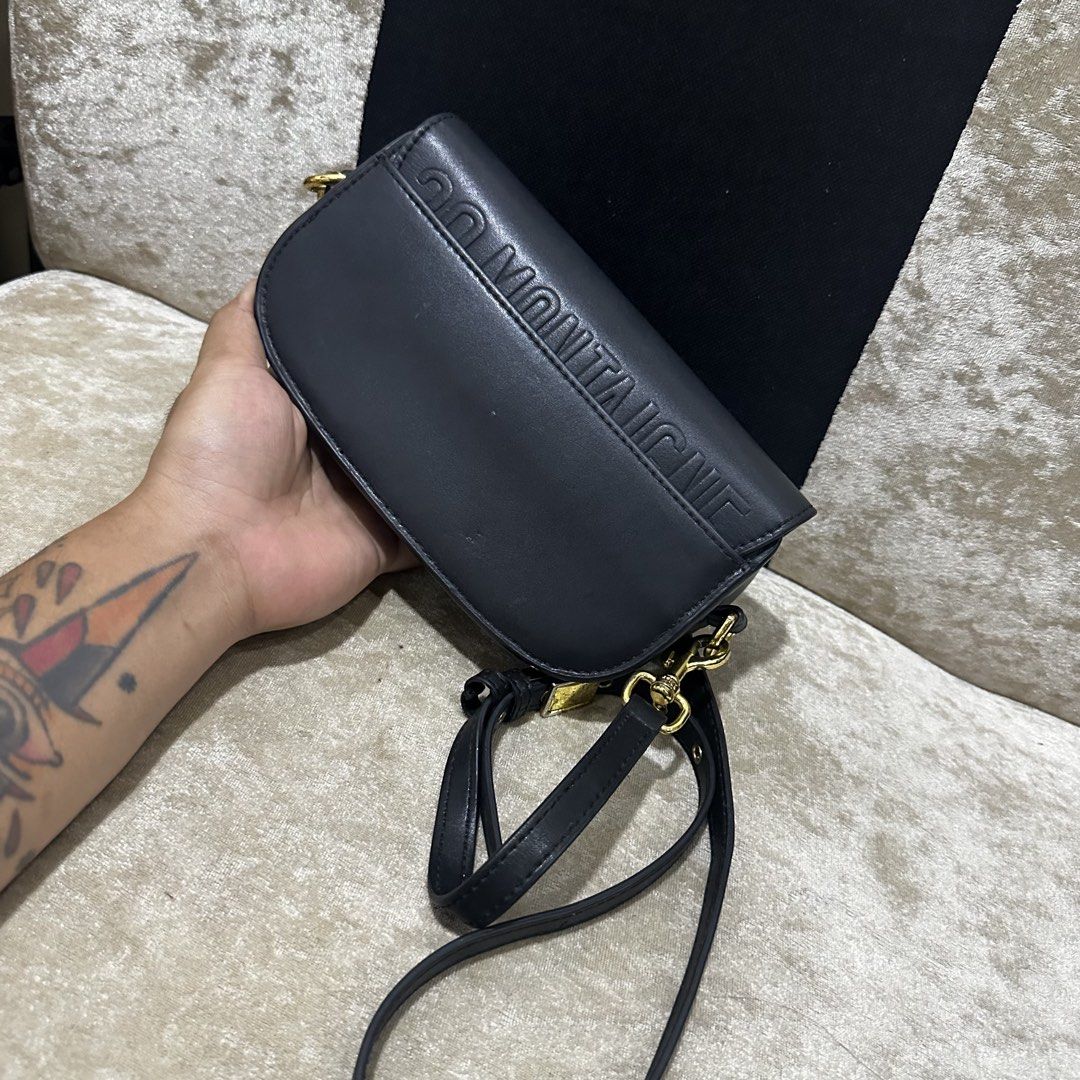 Christian Dior Bobby Bag Black Leather (Category: Luxury Bags & Wallets) located in Quezon City. Submitted by retroboominwantsummoh (Listing ID 1467964823, Image 2). Description: - Brand: Christian Dior - Material: Premium black leather - Hardware: Gold-tone with iconic CD front clasp - Details: Embossed "30 Montaigne" on the back - Strap: Adjustable and removable leather strap - Interior: Heat stamped with "Christian Dior Paris Made in Italy" - 