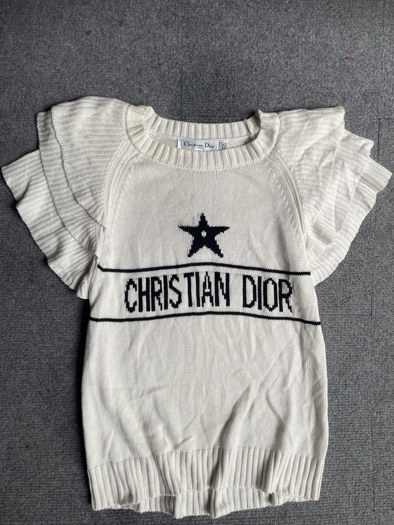 Christian dior knitter blouse (Category: Luxury Apparel) located in Tacloban City. Submitted by solothriftfinds (Listing ID 1467912899, Image 1). Description: Christian dior knitted blouse Good condition.