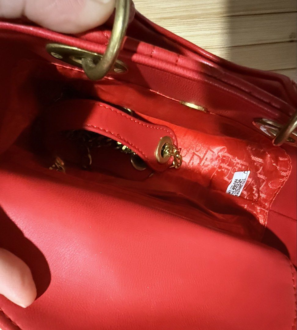 Christian Dior Lady Dior Red Handbag (Category: Luxury Bags & Wallets) located in Caloocan City. Submitted by shnicky101 (Listing ID 1468000876, Image 3). Description: DIOR Mini Lady Dior (Red Cannage Lambskin) Details & Condition: Classic red Cannage quilted lambskin with pale gold-tone D.I.O.R. charms. Good preloved condition overall; minor peeling on back handle (shown in photos). Gifted item (no receipt) .