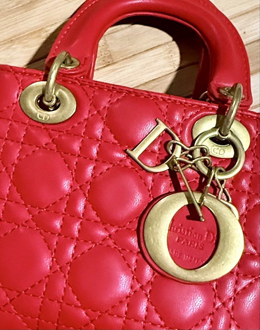 Christian Dior Lady Dior Red Handbag (Category: Luxury Bags & Wallets) located in Caloocan City. Submitted by shnicky101 (Listing ID 1468000876, Image 2). Description: DIOR Mini Lady Dior (Red Cannage Lambskin) Details & Condition: Classic red Cannage quilted lambskin with pale gold-tone D.I.O.R. charms. Good preloved condition overall; minor peeling on back handle (shown in photos). Gifted item (no receipt) .