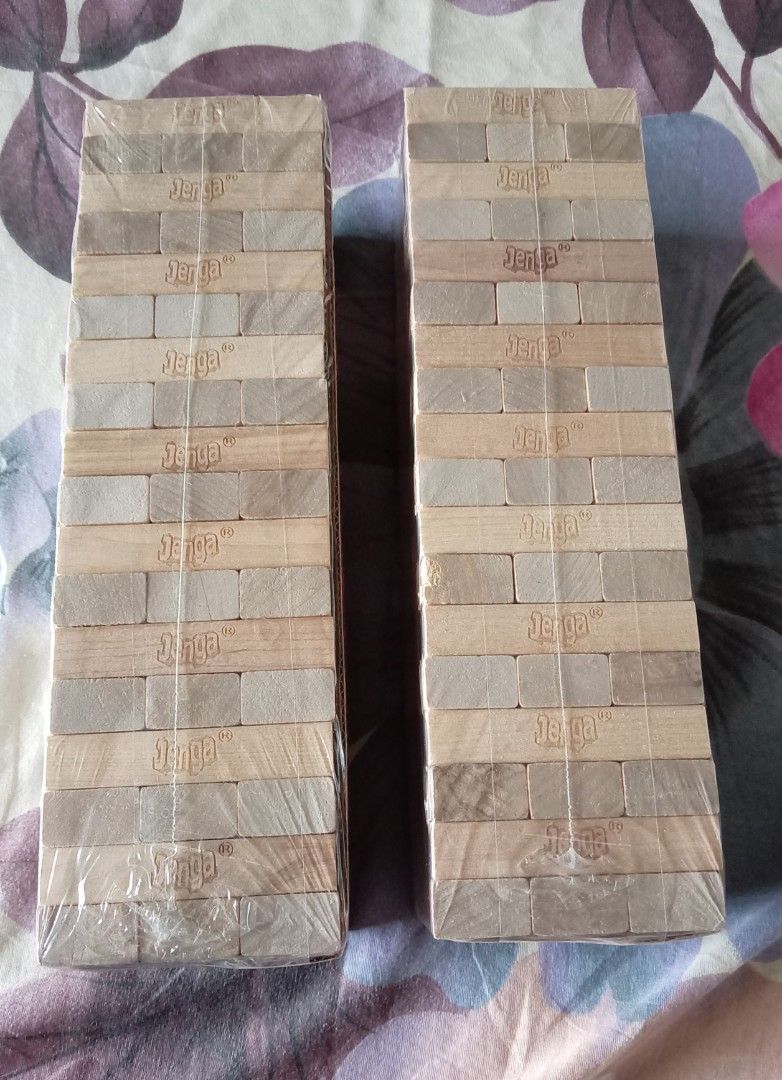 Classic Jenga Game Hasbro 54 Hardwood Blocks (Category: Board Games & Puzzles) located in Quezon City. Submitted by chacha30.s (Listing ID 1467923774, Image 2). Description: - Item: Classic Jenga Game - Quantity: 2 boxes available (buy 1 or take both!) - Includes: 54 sturdy hardwood blocks and stacking sleeve - For ages: 6 years old and up - Perfect for: Parties, family game nights, and gatherings - Condition: Brand new and complete . Text me at 