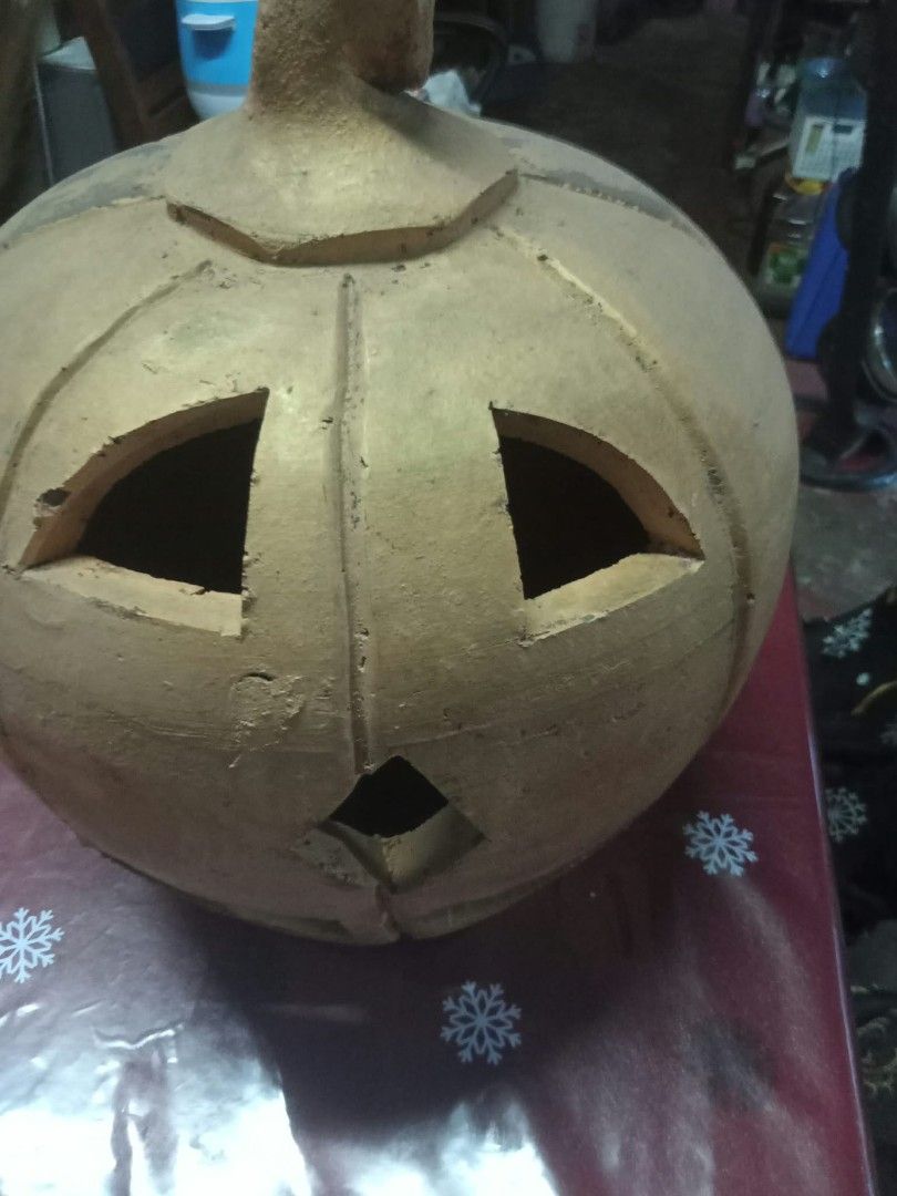 Clay Pumpkin Jack-o'-lantern Halloween Decor (Category: Figurines & Statues) located in Quezon City. Submitted by madelrivera (Listing ID 1467996445, Image 1). Description: - Handmade clay jack-o'-lantern pumpkin - Natural earth-toned finish with carved triangle eyes, diamond nose, and smile - Sturdy stem detail on top - Heavy and solid material for durability - Ideal for autumn and Halloween home setups.