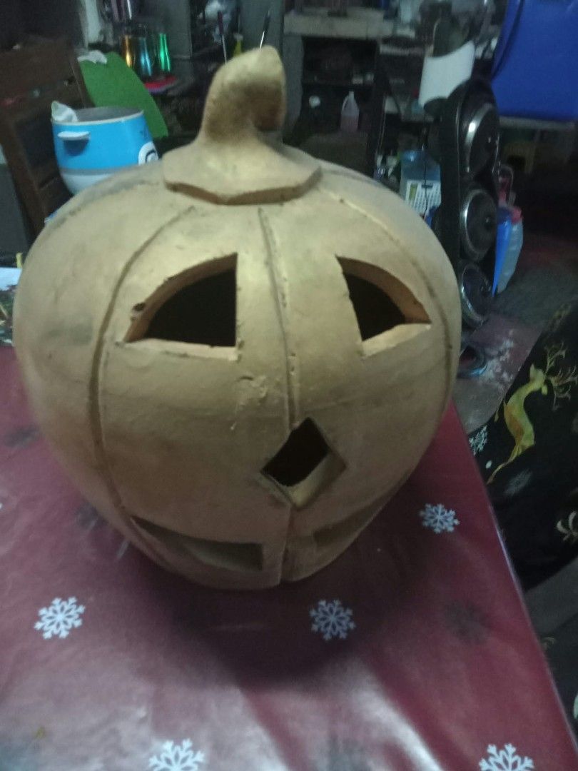 Clay Pumpkin Jack-o'-lantern Halloween Decor (Category: Figurines & Statues) located in Quezon City. Submitted by madelrivera (Listing ID 1467996445, Image 3). Description: - Handmade clay jack-o'-lantern pumpkin - Natural earth-toned finish with carved triangle eyes, diamond nose, and smile - Sturdy stem detail on top - Heavy and solid material for durability - Ideal for autumn and Halloween home setups.