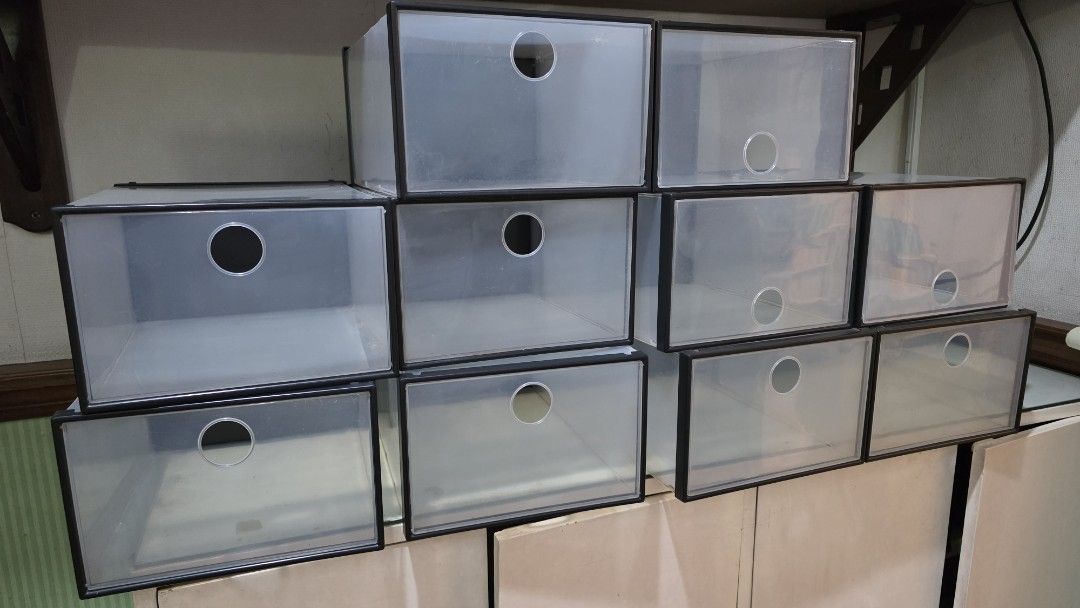 Clear stackable plastic shoe storage boxes organizer (Category: Storage Boxes & Baskets) located in Manila. Submitted by deeejybee (Listing ID 1467933830, Image 1). Description: - Clear plastic storage boxes with sleek black frames - Convenient drop-front doors for easy access - Built-in ventilation holes on front panels - Stackable and sturdy design to maximize space - Perfect for organizing shoes, bags, or accessories - Easy to assemble, clean,