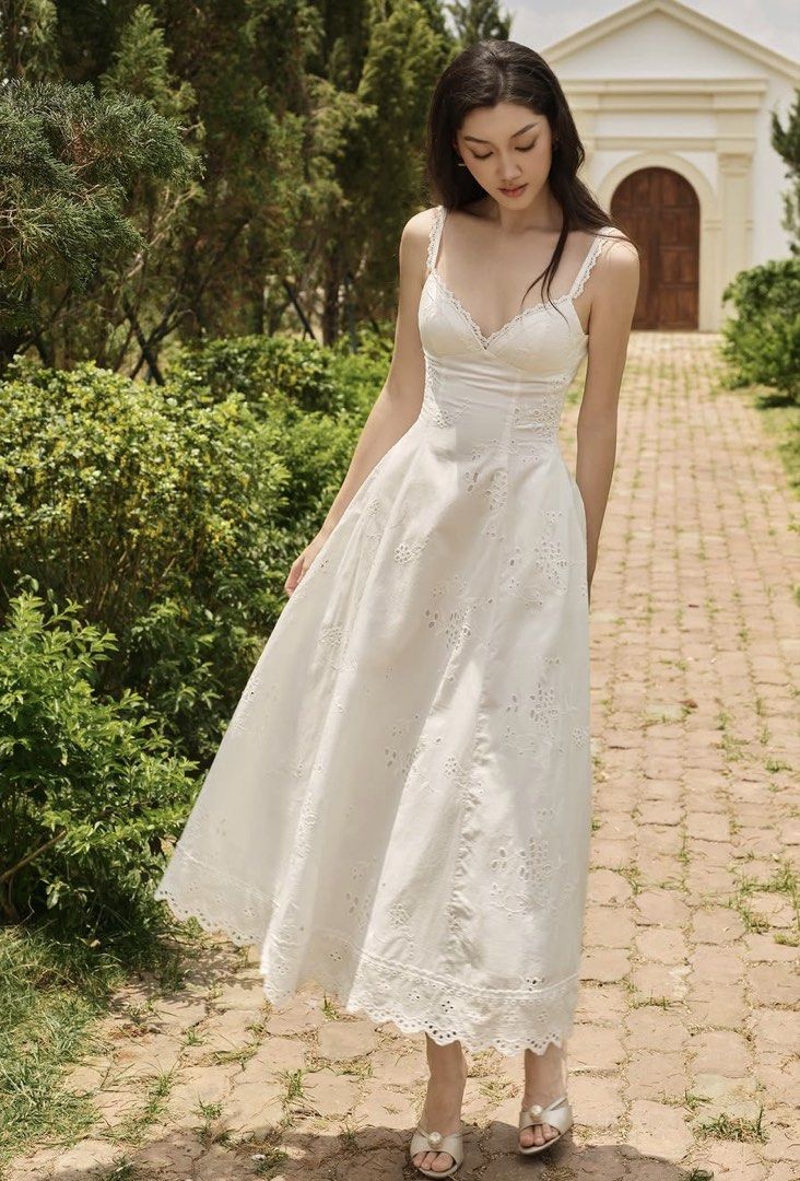Clothes Bar White Dress (Category: Dresses) located in Batangas. Submitted by kym2003 (Listing ID 1467999706, Image 1). Description: - Brand: Clothes Bar - Style: White midi dress with delicate eyelet embroidery and floral patterns - Fit & Design: Fitted bodice, flattering sweetheart neckline, thin spaghetti straps, and scalloped hemline - Material: Lightweight cotton, ideal for warm weather - Condition: used only once, can vouch as almost brand 