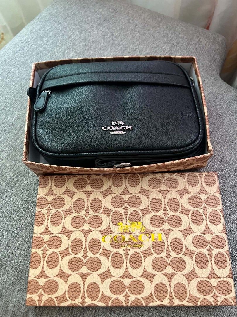 Coach Black Leather Crossbody Bag with Box (Category: Sling Bags) located in Manila. Submitted by incywincy_ (Listing ID 1467898249, Image 3). Description: - Authentic Coach crossbody bag - Color: Classic black with silver hardware - Material: Premium textured leather - Features: Front logo, front slip pocket, and adjustable shoulder strap - Inclusion: Original Coach signature print box .