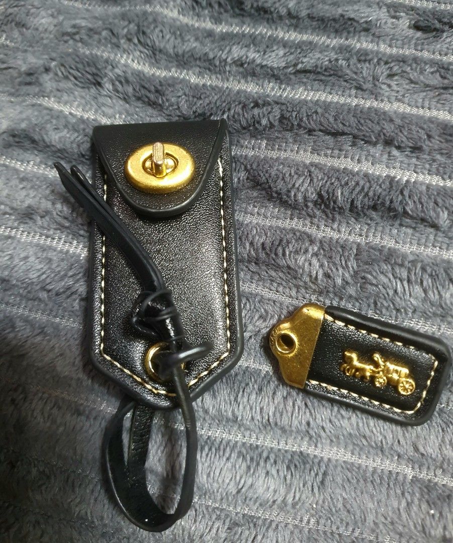Coach Leather Bag Charms and Hangtags Set (Category: Charms) located in Manila. Submitted by mozaitv1236506 (Listing ID 1467919099, Image 1). Description: - Authentic Coach bag charms and hangtags bundle - Includes black leather turnlock tag and black leather tag with gold horse and carriage logo - Comes with two blue leather hangtags on a metal ball chain - Perfect for customizing and mixing/matching on your favorite handbags or totes - Conditio