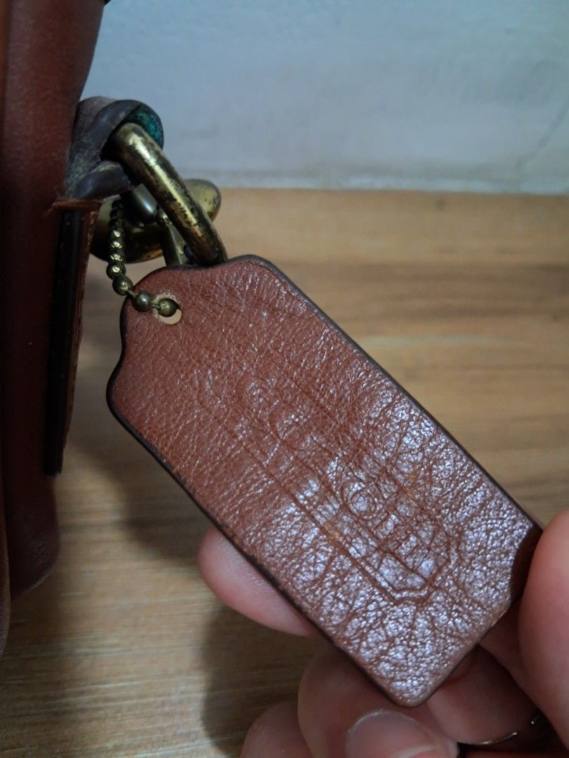 Coach Penny (Category: Luxury Bags & Wallets) located in Muntinlupa City. Submitted by msshoppingera (Listing ID 1467913857, Image 3). Description: Coach leather crossbody bag. Colour tan. Light scratches at the back. No scuffings, no peeling, no stickiness, no foul smell. Measurements: 7.75" (L) x 5" (H) x 2.25" (W) All items are available unless marked as sold. Payment first before shipping. Buyer will pay for shipping. No return No exchange.
