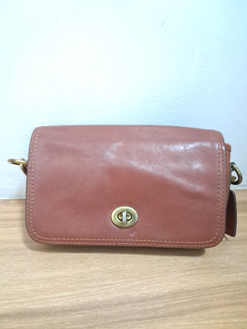Coach Penny (Category: Luxury Bags & Wallets) located in Muntinlupa City. Submitted by msshoppingera (Listing ID 1467913857, Image 1). Description: Coach leather crossbody bag. Colour tan. Light scratches at the back. No scuffings, no peeling, no stickiness, no foul smell. Measurements: 7.75" (L) x 5" (H) x 2.25" (W) All items are available unless marked as sold. Payment first before shipping. Buyer will pay for shipping. No return No exchange.