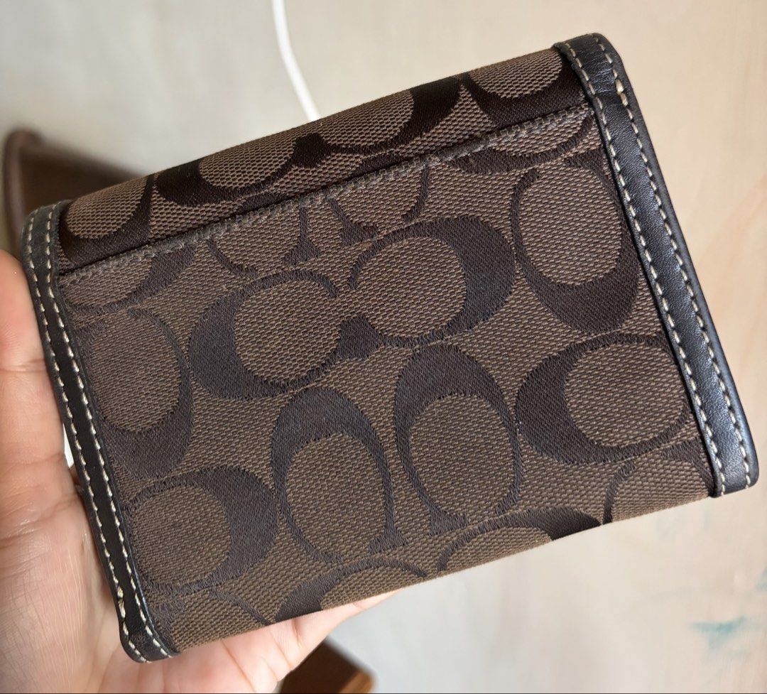 Coach Signature C Choco Brown Canvas Tri-Fold Wallet (Category: Luxury Bags & Wallets) located in Dagupan City. Submitted by beltranmon75535 (Listing ID 1467864078, Image 2). Description: Coach Choco Brown Trifold Wallet 🤎🤎 Normal signs of use Overall in good condition Kindly check each photo for full details Please manage your expectations Location: Dagupan City Add sf Payment first 💸 First to pay basis | No reservations 📩📩.