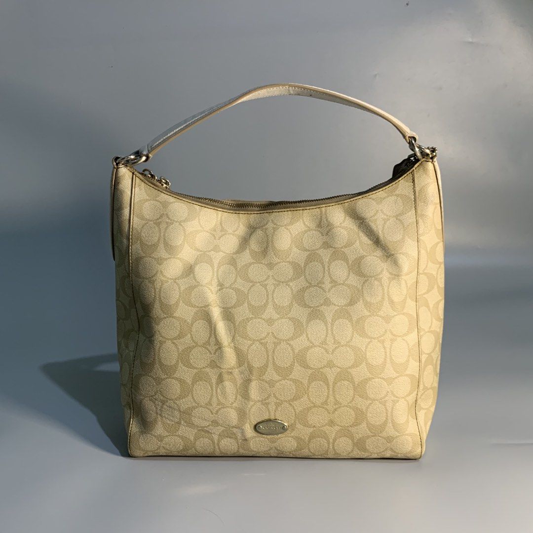 Coach Signature Hobo bag (Category: Luxury Bags & Wallets) located in Davao. Submitted by jandyfuert21303 (Listing ID 1468017830, Image 1). Description: Verygood condition Need minor cleaning only Complete with sling Have signs of usage but presentable to wear.