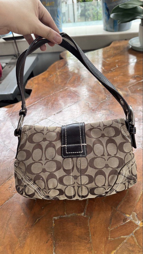 Coach Soho Baguette (Category: Luxury Bags & Wallets) located in Tagbilaran City. Submitted by Bunnybebu (Listing ID 1467920238, Image 2). Description: In very good used condition Small size Check all photos for signs of use/minimal flaws Sold as is. What you see is what you get Ask questions before u bid. 📍Tagbilaran City, Bohol ⚠️ This is a thrifted item so please manage your expectations. ❎ Bawal sa maselan at maarte ‼️All sales are final. ‼️